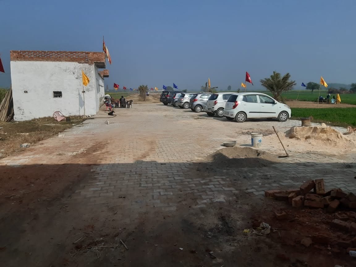 Paved internal road with visitors' cars